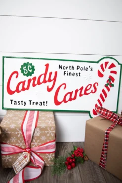 23.6” Metal Holiday North Pole’s Finest Candy Canes Wall Sign